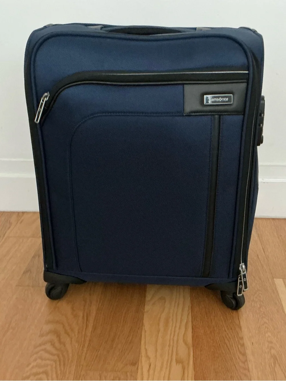 Samsonite Optimum softside spinner carry-on suitcase.